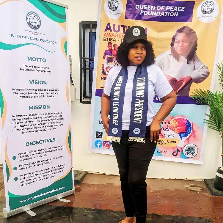 Founder standing with campaign motto board during awareness event