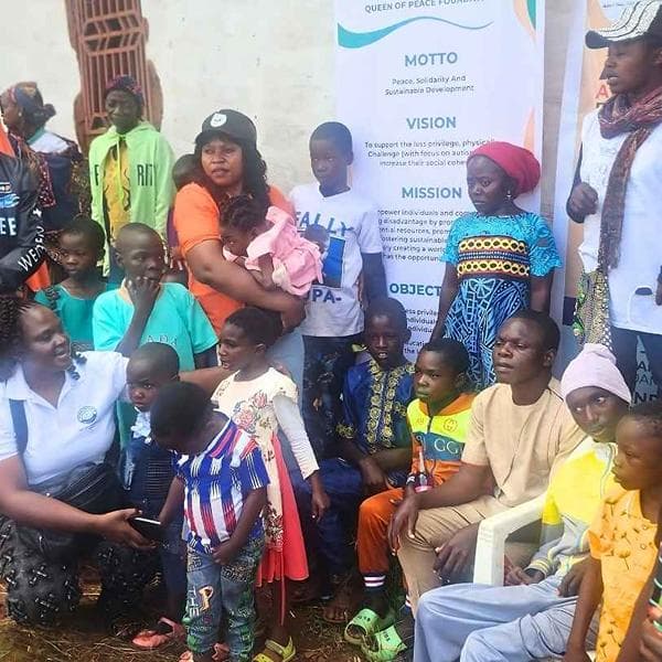 Founder Quinta Layin Tuleh with autistic children in Africa